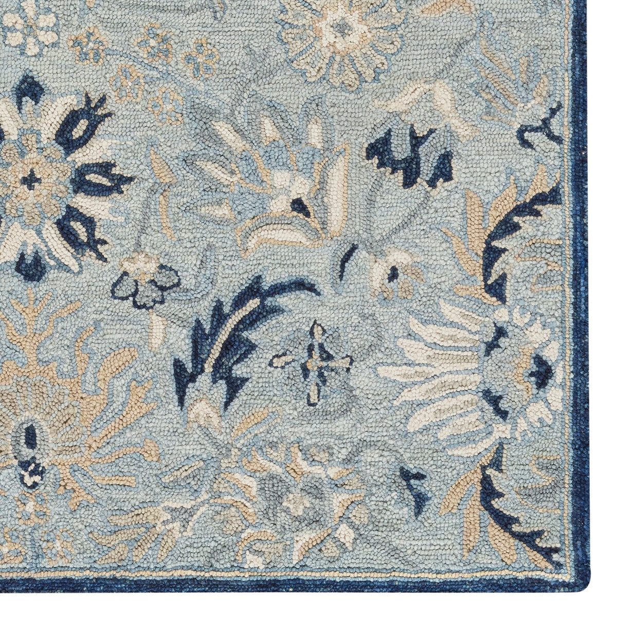 Floral patterned rug with blue and beige colors