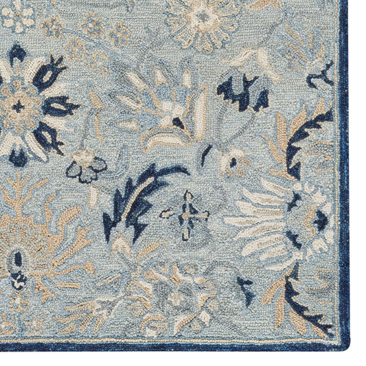 Floral patterned rug with blue and beige colors