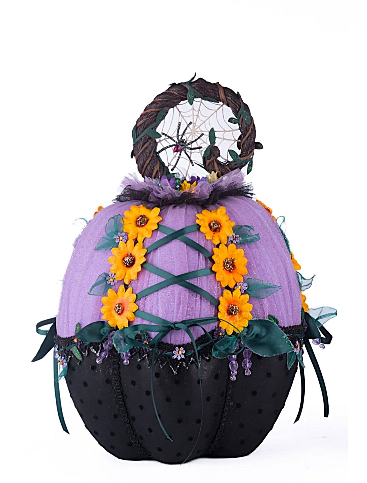 Decorative pumpkin with purple top, black bottom, yellow flowers, and a dreamcatcher on a white background