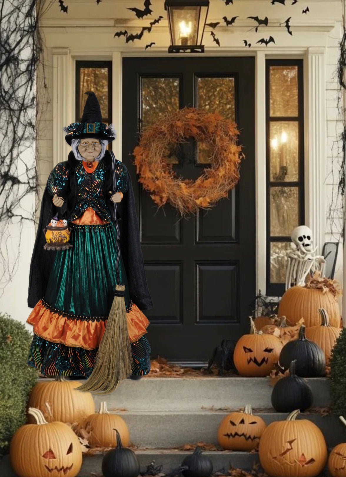 Halloween-themed front porch with decorative pumpkins, wreath, and witch figure.
