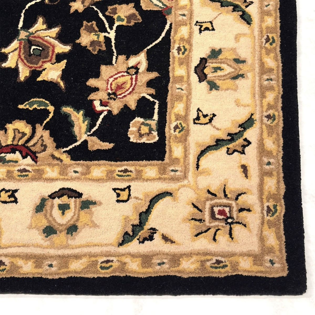 Close-up of an ornate rug with floral patterns on a white background