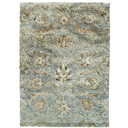 Decorative floral rug with intricate patterns on a light blue background