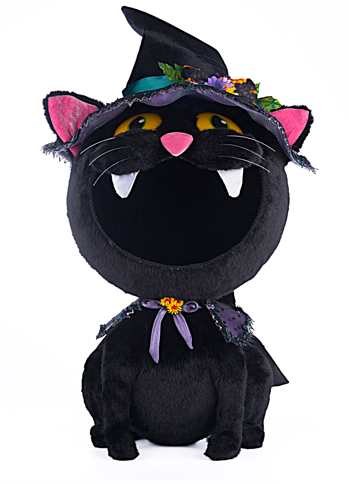 Black cat plush toy with witch hat and purple scarf on a white background