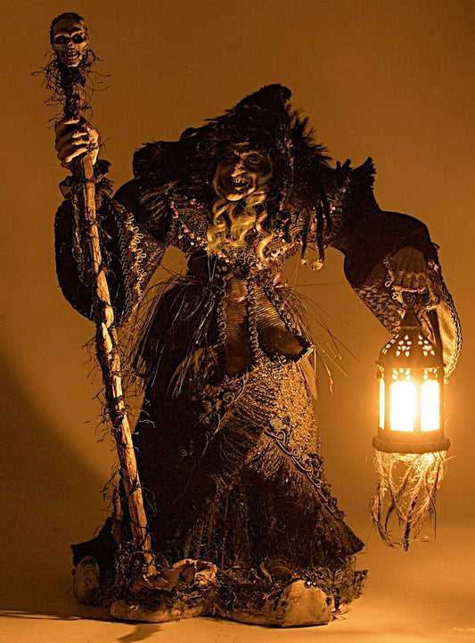 Decorative figure with a lantern and staff against a warm background
