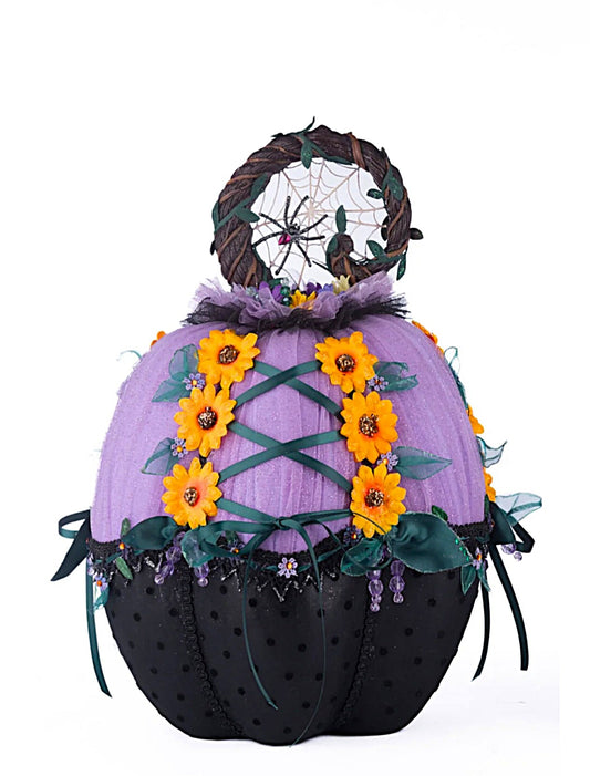 Decorative pumpkin with purple top, black bottom, yellow flowers, and a dreamcatcher on a white background